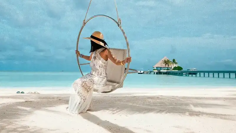 Woman enjoying a beach lifestyle symbolizing the benefits of online income opportunities for seniors